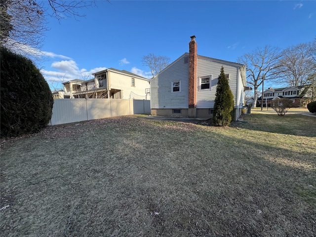 view of home's exterior featuring a lawn