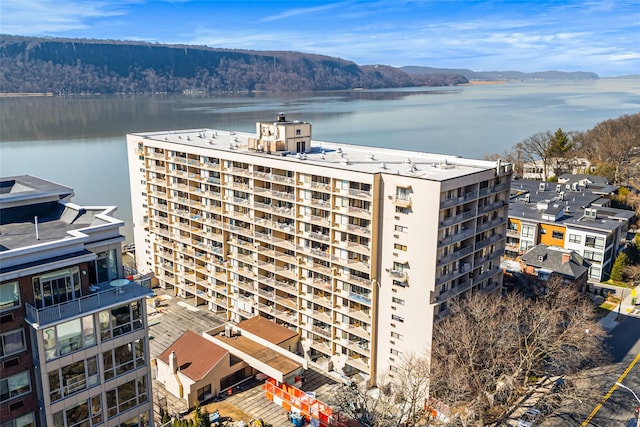view of building exterior with a water view