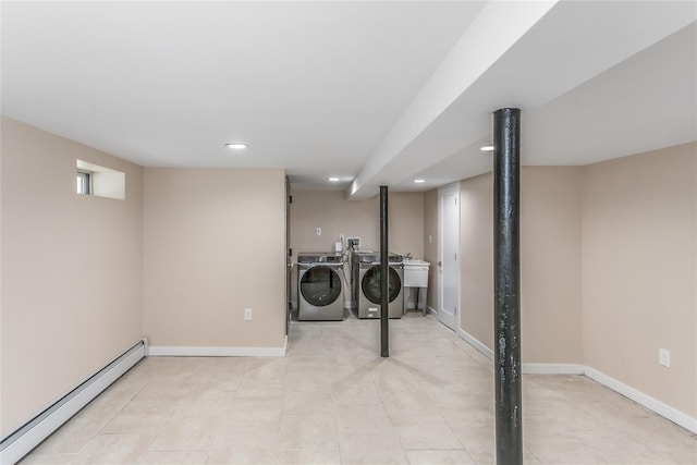 laundry room featuring sink, independent washer and dryer, and baseboard heating