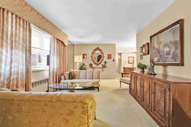 living room with light carpet and radiator