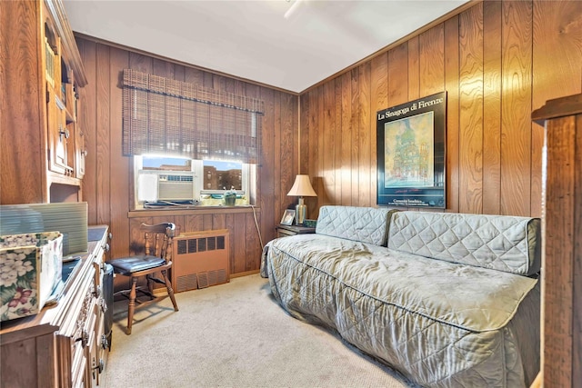 carpeted living room with radiator, cooling unit, and wood walls