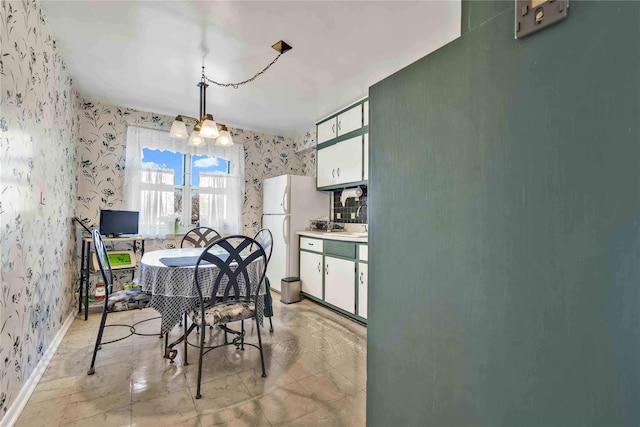 dining room with a notable chandelier