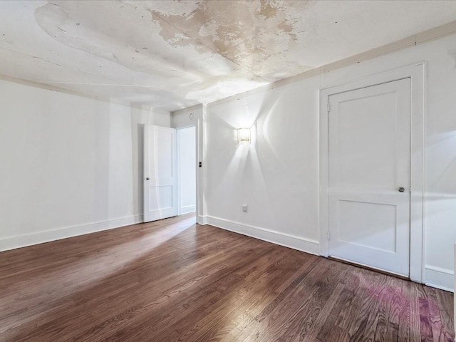 unfurnished room featuring hardwood / wood-style flooring