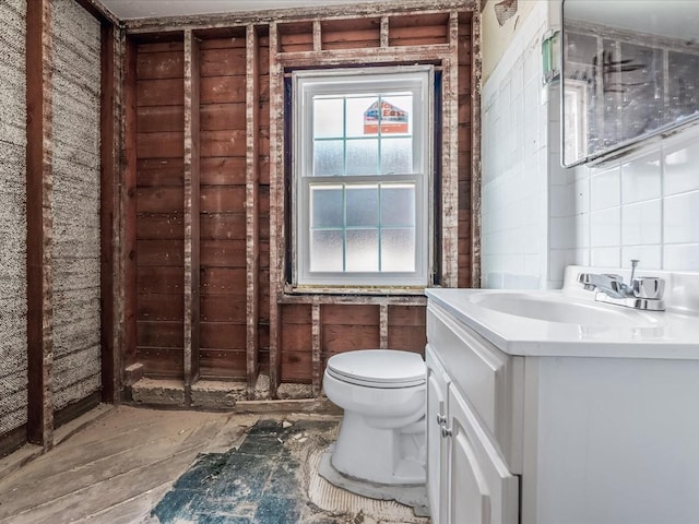 bathroom featuring toilet and vanity