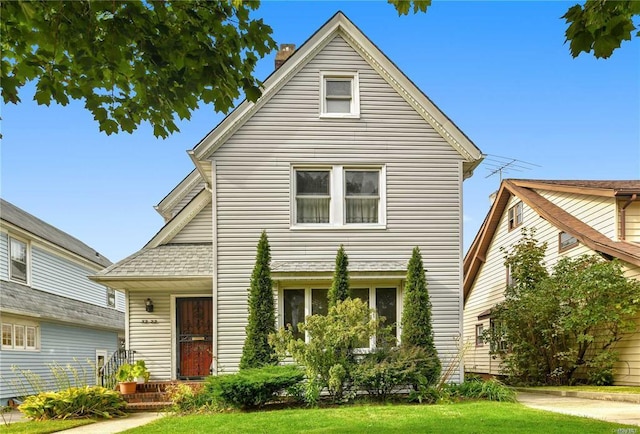 front facade with a front lawn