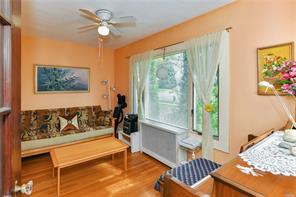 interior space with ceiling fan and light hardwood / wood-style floors