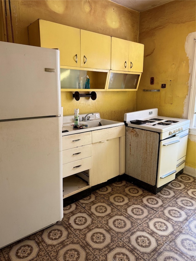 kitchen with sink and white appliances