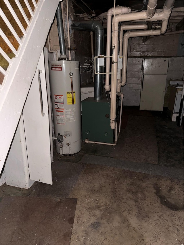 utility room with gas water heater