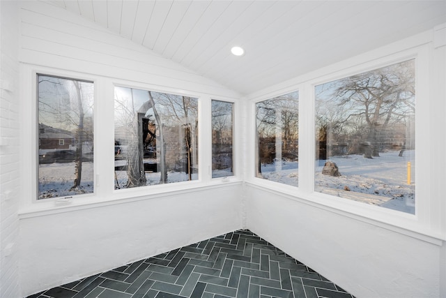 unfurnished sunroom with vaulted ceiling