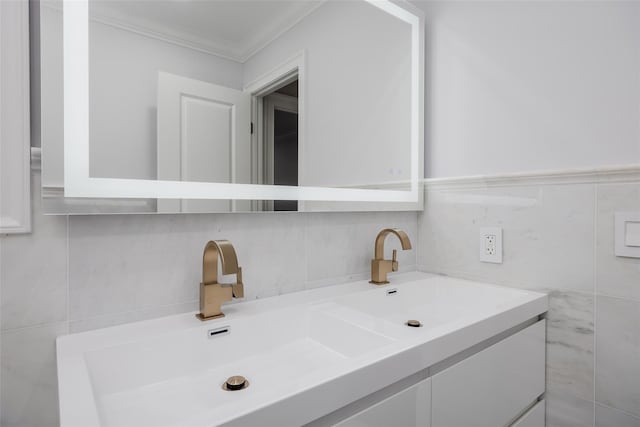 bathroom with vanity, backsplash, and ornamental molding