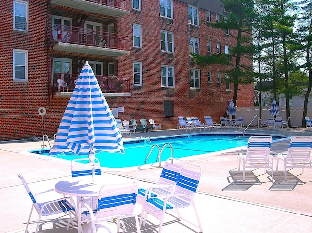 view of swimming pool featuring a patio