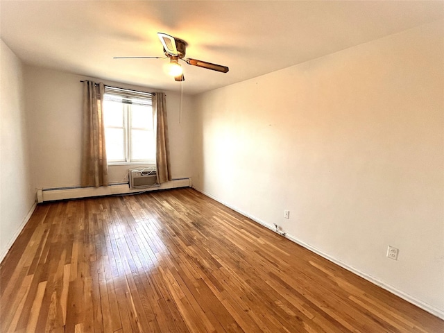 spare room with ceiling fan, a baseboard radiator, and hardwood / wood-style floors