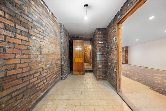 hallway with brick wall