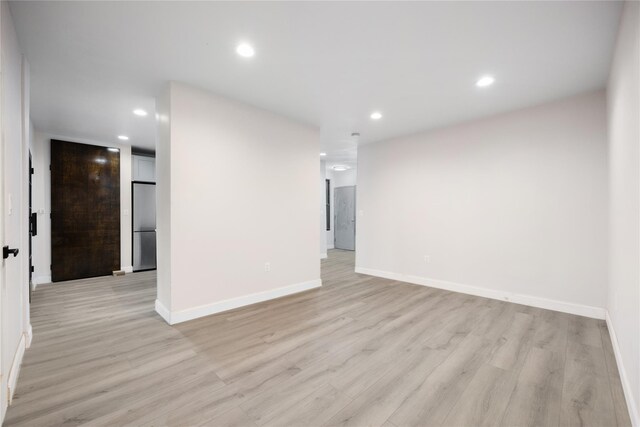 unfurnished room featuring light wood-type flooring