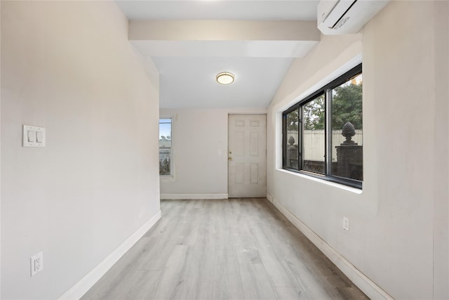 hallway with light wood-type flooring and lofted ceiling with beams