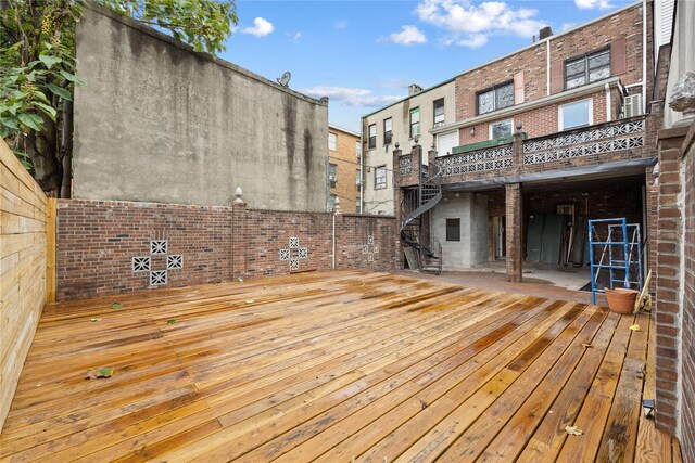 wooden deck with a patio area