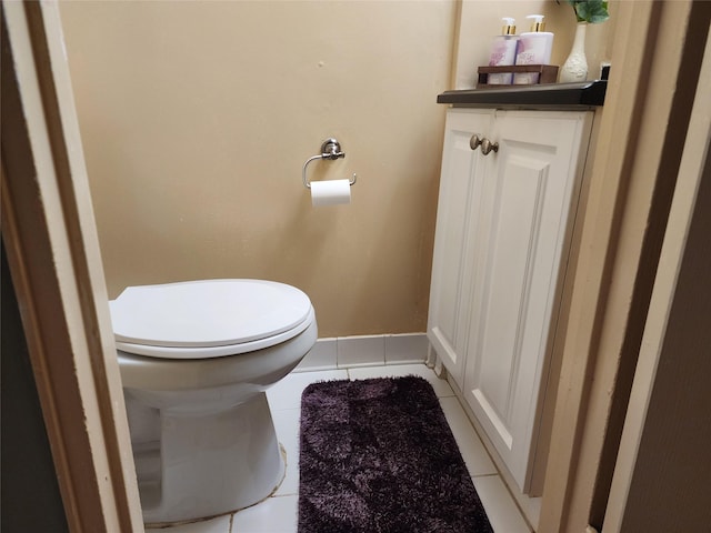 bathroom with toilet, tile patterned floors, and vanity