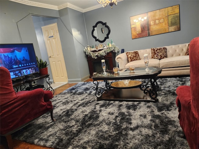 living room with ornamental molding and hardwood / wood-style floors