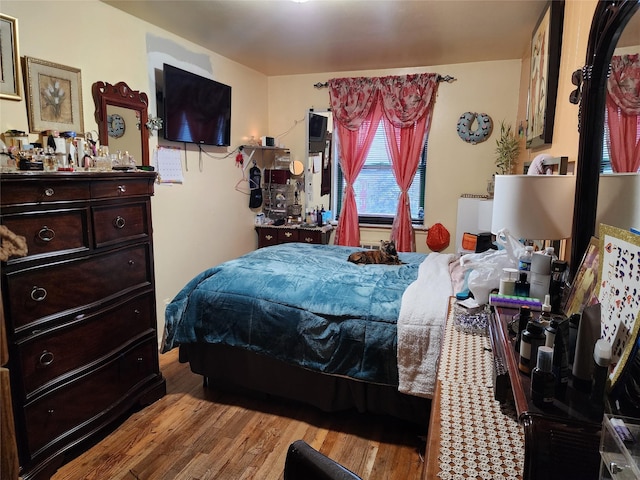 bedroom with light hardwood / wood-style flooring