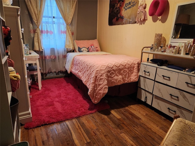 bedroom with hardwood / wood-style flooring