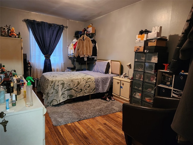 bedroom featuring hardwood / wood-style floors