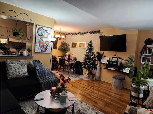 living room featuring hardwood / wood-style flooring and a notable chandelier