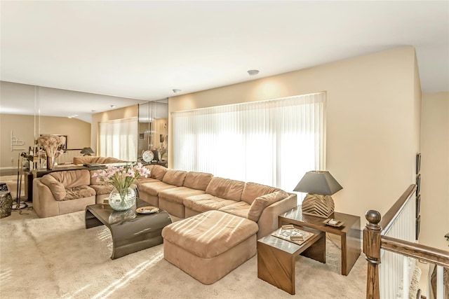 carpeted living room featuring a wealth of natural light