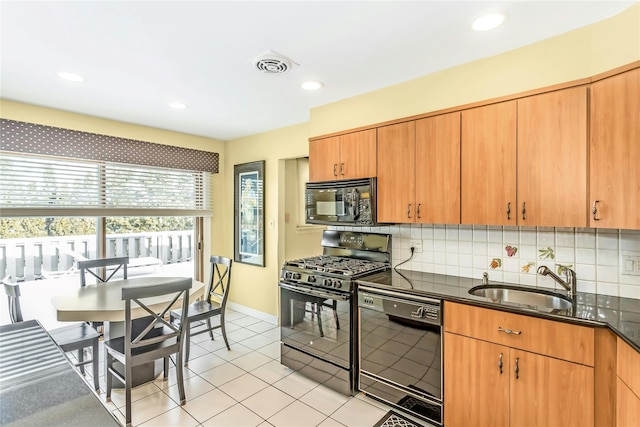 kitchen with sink, light tile patterned floors, black appliances, and tasteful backsplash