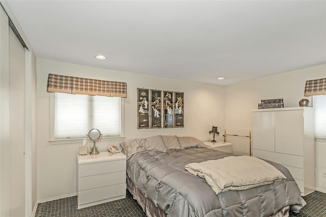 carpeted bedroom with a closet