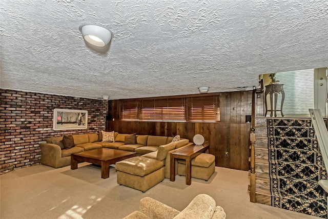 carpeted living room with brick wall and wooden walls