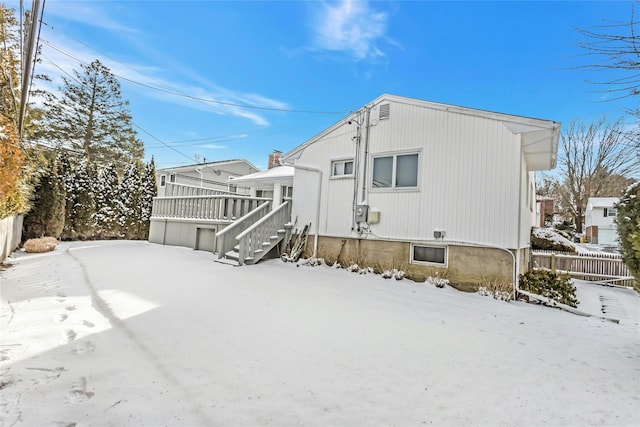 view of snow covered house