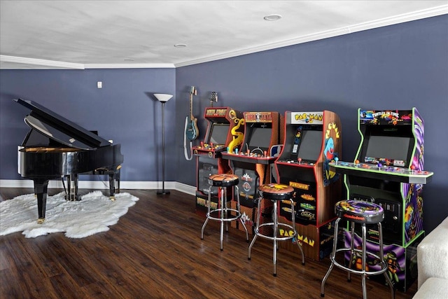 game room featuring bar area, dark hardwood / wood-style flooring, and ornamental molding