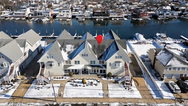 birds eye view of property featuring a water view