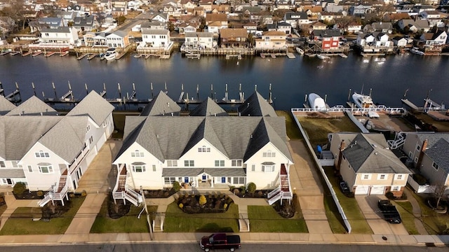 aerial view featuring a residential view and a water view