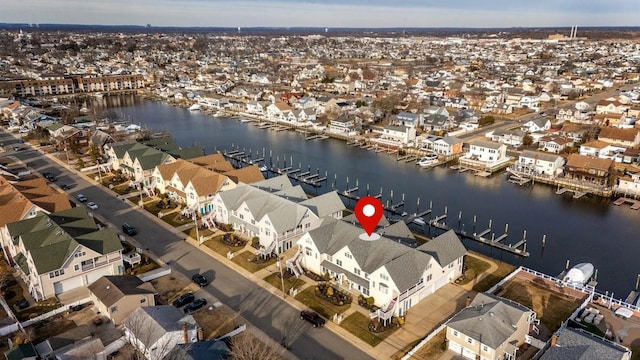 bird's eye view featuring a water view and a residential view