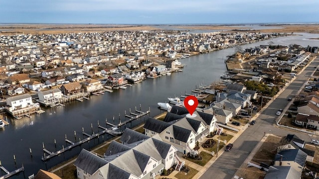 aerial view with a water view and a residential view