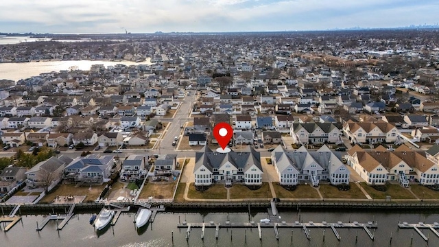 bird's eye view featuring a residential view and a water view