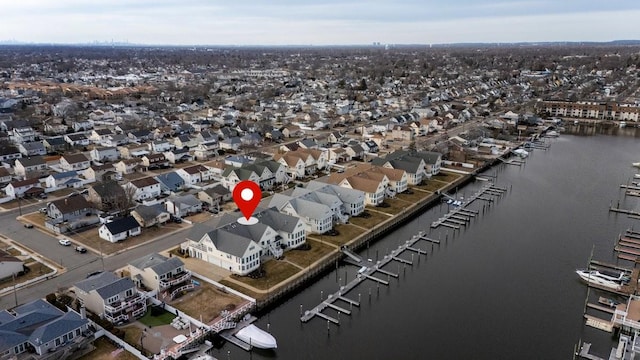 birds eye view of property featuring a water view and a residential view