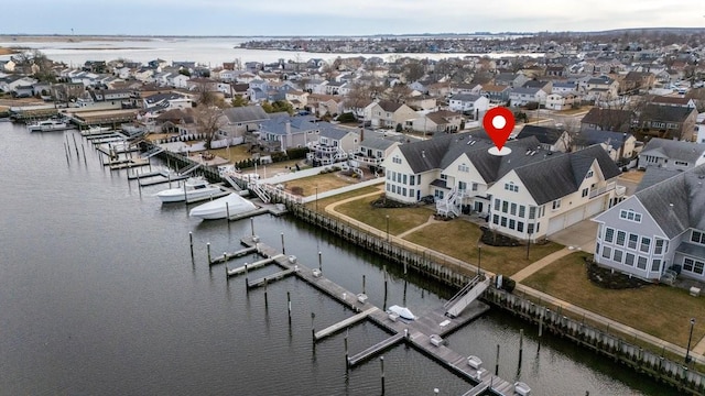 aerial view featuring a water view and a residential view