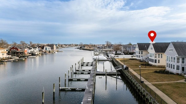 dock area with a water view and a residential view