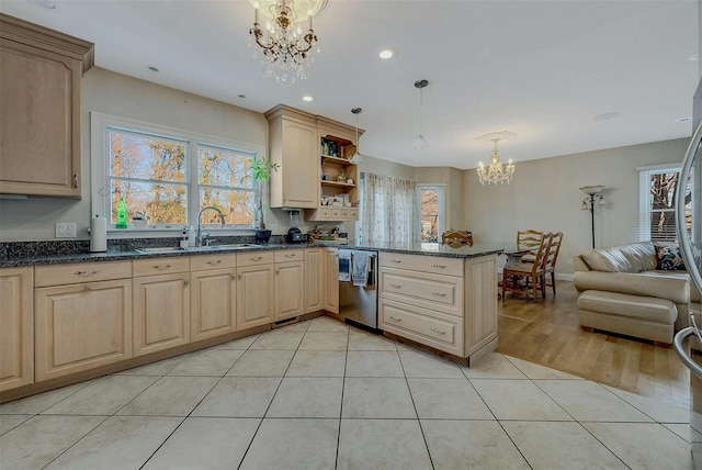 kitchen with sink, hanging light fixtures, light tile patterned flooring, a chandelier, and light brown cabinets