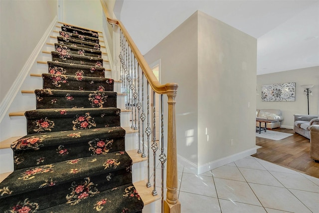 staircase with tile patterned floors