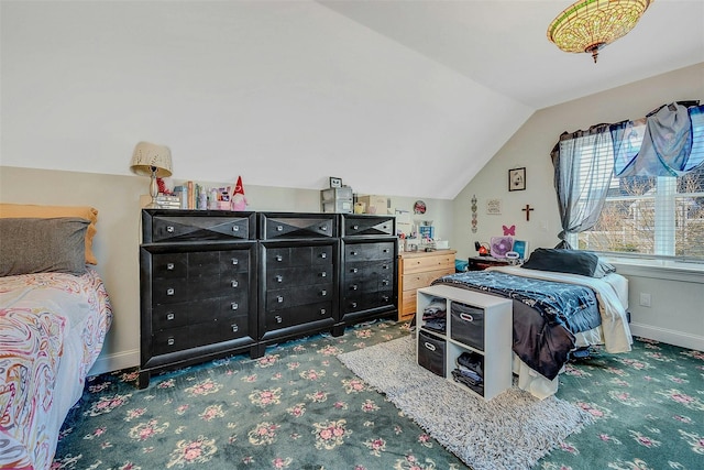 carpeted bedroom featuring lofted ceiling