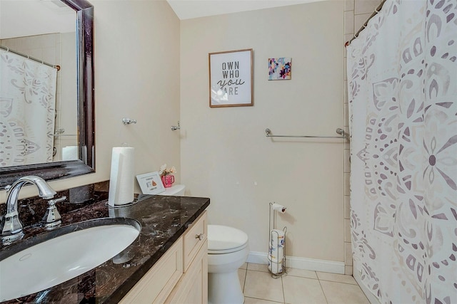 bathroom featuring a shower with curtain, vanity, toilet, and tile patterned flooring