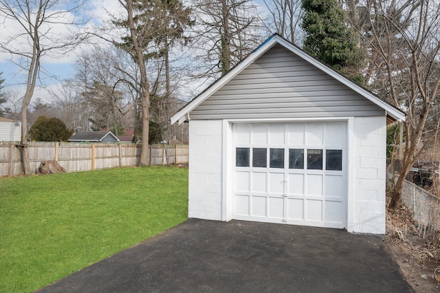 garage featuring a yard