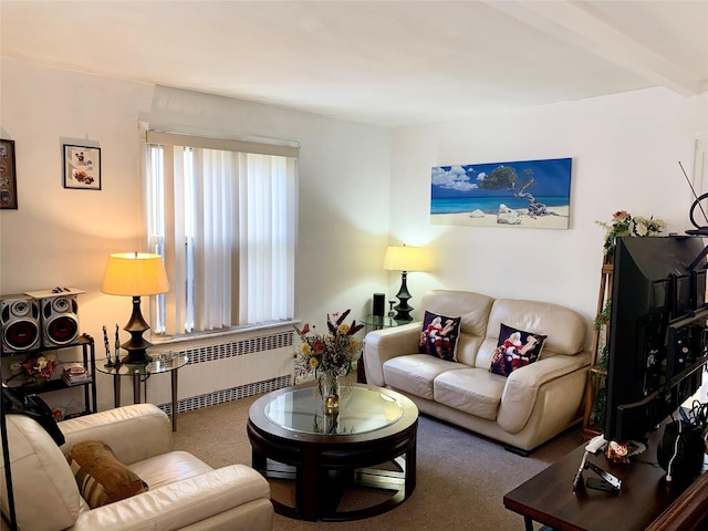 living room with carpet, radiator, and beam ceiling