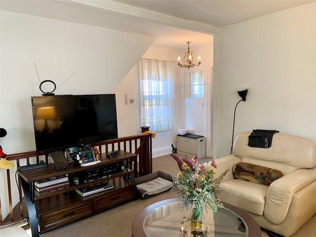 living room with carpet flooring, a notable chandelier, and vaulted ceiling