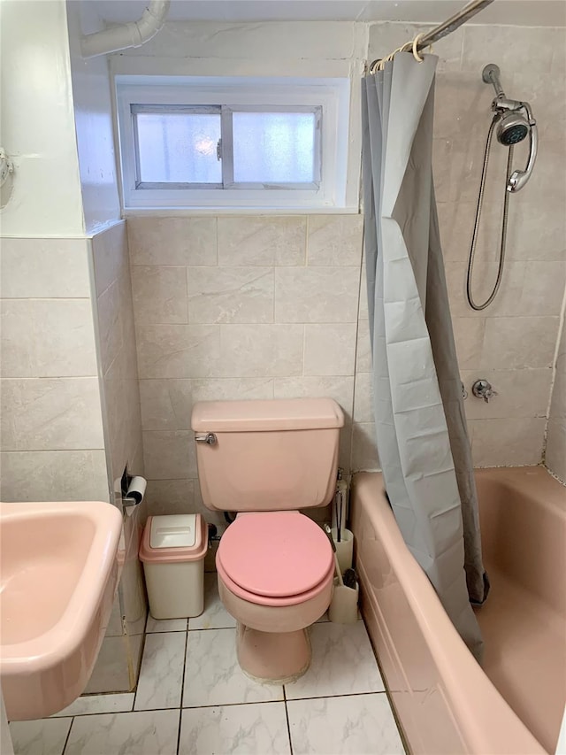 bathroom with toilet and shower / tub combo