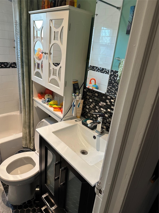 full bathroom with toilet, decorative backsplash, shower / bath combination with curtain, and vanity