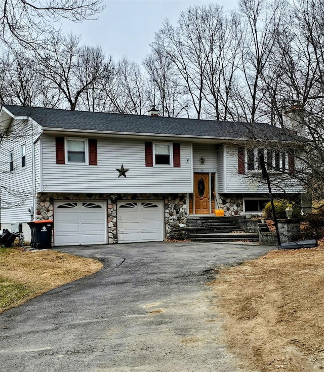 split foyer home featuring a garage